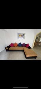 a bed with pillows on the floor in a room at The Little House in Hiriketiya