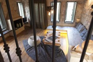 a living room with a couch and a table at Opora Country Living in Nafplio