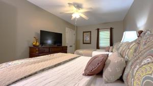 a bedroom with two beds and a flat screen tv at Mar Vista Grande - 806 in Myrtle Beach