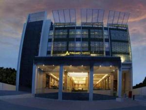 a building with aavid services sign on the front of it at pyramid suites Hotel in Banjarmasin