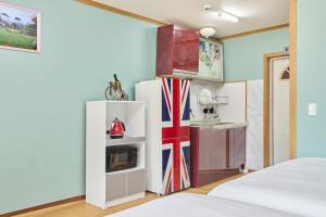 a room with a refrigerator and a kitchen at Heidi Korea in Hongcheon