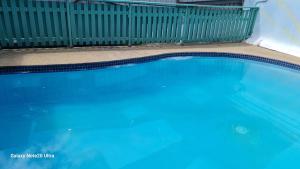 a large blue swimming pool in a yard at Cozy Studio Apt Pool Free WIFI in Suva