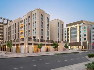 a rendering of a building with a street at ibis Styles Dubai Gold District in Dubai
