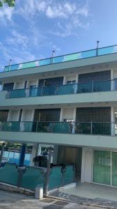 a building with balconies on the side of it at Appartamento Espero in Gabicce Mare