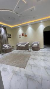 a living room with three beds and a fireplace at alula apartment in Quai