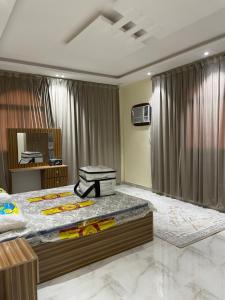 a bedroom with a large bed and a mirror at alula apartment in Quai