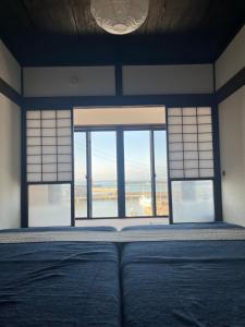 Ένα ή περισσότερα κρεβάτια σε δωμάτιο στο Gekko-yoku