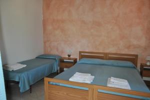 Postel nebo postele na pokoji v ubytování Agriturismo Vaddidulimu