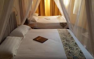 Ένα ή περισσότερα κρεβάτια σε δωμάτιο στο Toque &GN Accommodation Nairobi