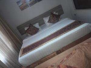 Ένα ή περισσότερα κρεβάτια σε δωμάτιο στο Toque &GN Accommodation Nairobi