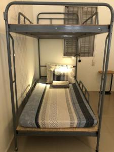 a bunk bed in a room with a bunk bedutenewayangering at Dorm Can Tho in Can Tho