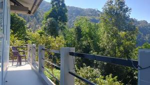 a balcony with a view of the mountains at Sayatri stay in Karsiyang