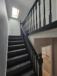 a staircase in a house with a window at Brogans Apartment in Trim