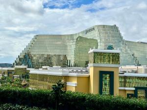 a large building with a sign on the side of it at Modern Seaview 1BR Near Okada Manila Bay Airport 17 in Manila