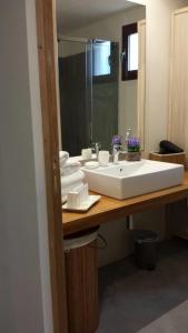a bathroom with a white sink and a mirror at Agroturismo Can Pere Rei in Son Serra de Marina