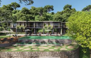 an exterior view of a resort with a swimming pool at vrihee resort in Weligama