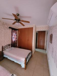 Postel nebo postele na pokoji v ubytování Kalampakas Guesthouse