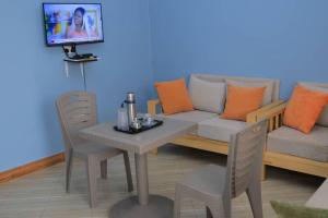 TV a/nebo společenská místnost v ubytování Kimani's Rock