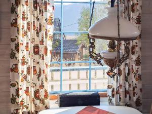 a window with a table and a lamp in front of it at 6 person holiday home in Åkra-By Traum in Kyrping