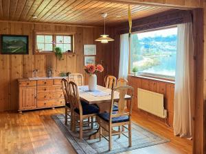 a kitchen with a table and chairs and a window at 7 person holiday home in STRYN-By Traum in Stryn