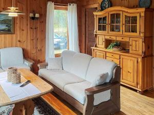 a living room with a couch and a table at 7 person holiday home in STRYN-By Traum in Stryn