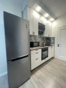 Kuchyň nebo kuchyňský kout v ubytování Mega