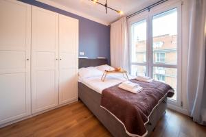 Posteľ alebo postele v izbe v ubytovaní Maya's Flats & Resorts 61 - Love Bridge