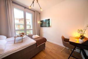 Televízia a/alebo spoločenská miestnosť v ubytovaní Maya's Flats & Resorts 61 - Love Bridge