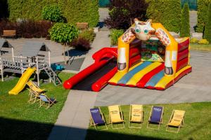 a playground with a unicorn on a slide at Hotel Porto in Radomsko