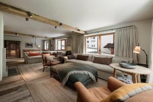 a living room with a couch and a table at Chalet Cecilia by MYALPS in Obergurgl