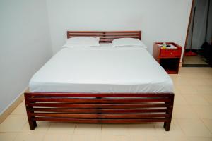 Postel nebo postele na pokoji v ubytování Lake Jay Hotel