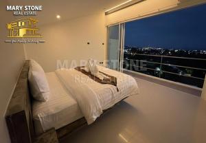 Postel nebo postele na pokoji v ubytování Charly Apartment - 2BR Seaview Cozy Apartment + 15 fotografií