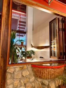 a large mirror reflecting a bathroom with a sink at New Yêu Biển homestay in Vĩnh Hy