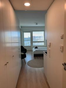 a small room with a desk and a window at RD Apartments - Areenan Lumo in Tampere