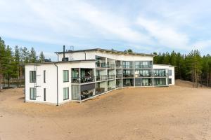 a large white building with a lot of windows at Meritähti 104 in Kalajoki