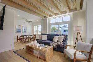 a living room with a blue couch and a table at Ocean Oasis in Encinitas