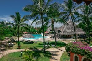 a view of a resort with a pool and palm trees at Crystal Bay Resort in Watamu
