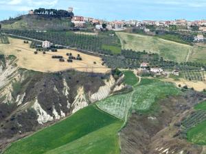 an aerial view of a golf course on a mountain at a sunny place in Silvi Marina