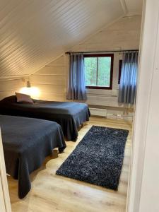 Ένα ή περισσότερα κρεβάτια σε δωμάτιο στο Levinkruunu B Visit Levi