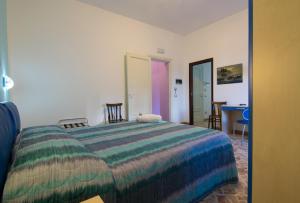 Posteľ alebo postele v izbe v ubytovaní B&B Alighieri 21
