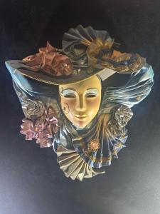 a statue of a woman with a hat and flowers at Hotel Villa Sofia in Truskavets