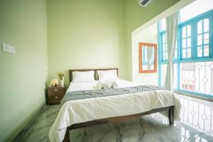 Postel nebo postele na pokoji v ubytování The Salty Soul A cozy Two Bedroom apartment + 13 fotografií