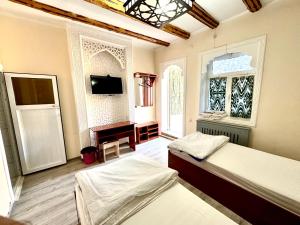 Katil atau katil-katil dalam bilik di Bukhara house hotel