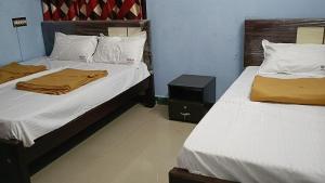 Ένα ή περισσότερα κρεβάτια σε δωμάτιο στο MNP Home Stay +29 φωτογραφίες