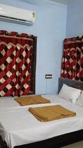 Ένα ή περισσότερα κρεβάτια σε δωμάτιο στο MNP Home Stay