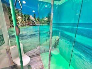 a bathroom with a toilet and a view of the ocean at Unusual converted bus for couples or families in Berck-sur-Mer