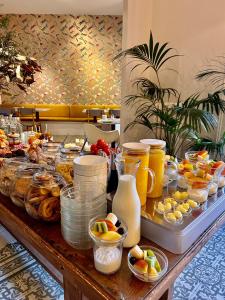 a buffet with a lot of food on a table at Forget Me Not Barcelona in Barcelona