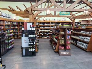 a store filled with lots of bottles of wine at Mountain Retreat in Chiriqu, Panama - Your Home Away from Home in Mata Francés