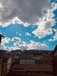 a view of a city under a cloudy sky at Torre Verde Acquapendente in Acquapendente