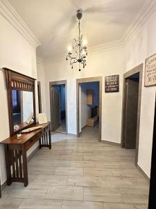 a large room with a piano and a chandelier at Home Turia Pio Apartamento de 3 habitaciones in Valencia